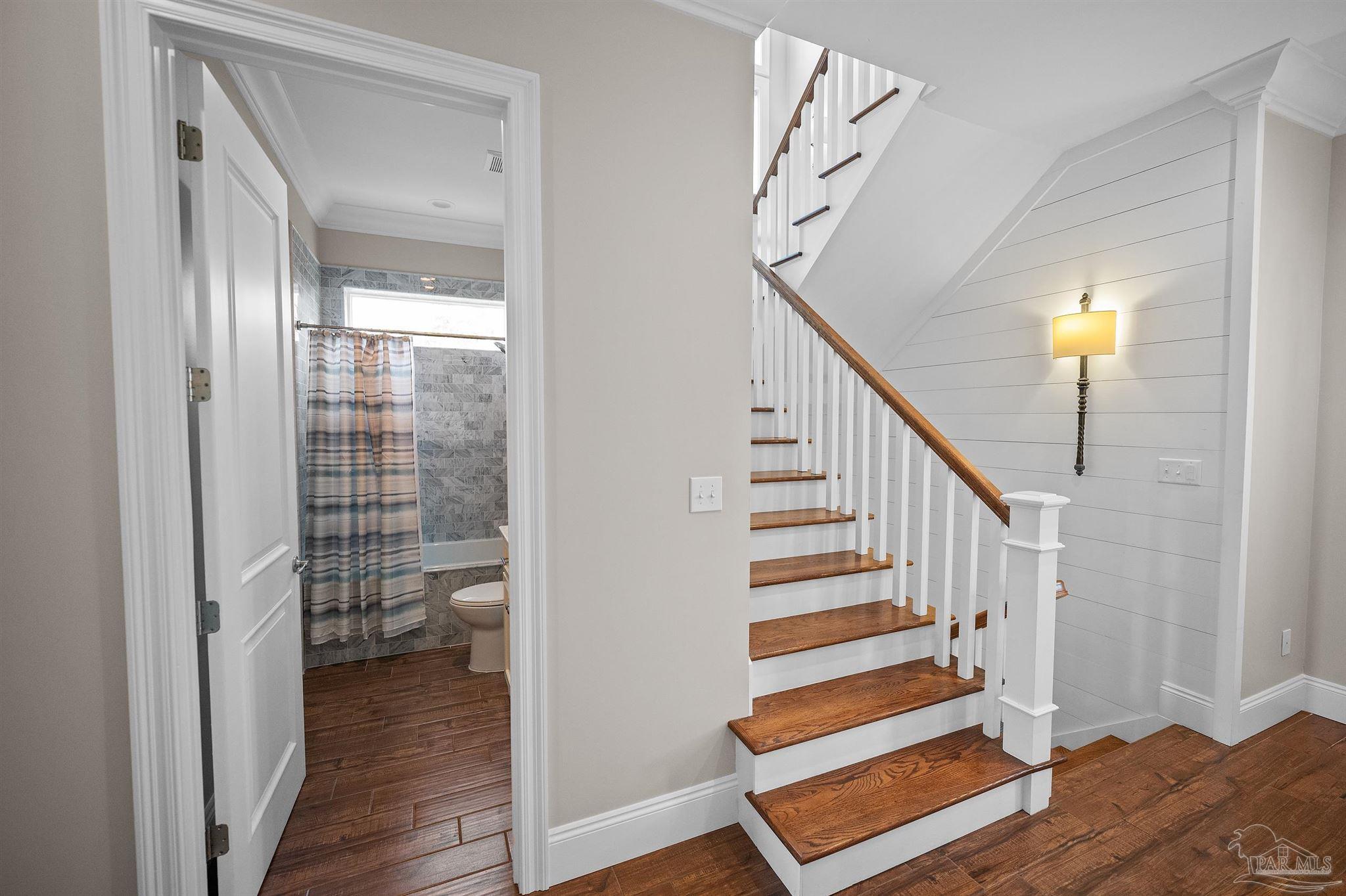 31729 River Road Orange Beach, AL 36561 - Photo 11 of 57 a view of entryway with wooden floor and stairs
