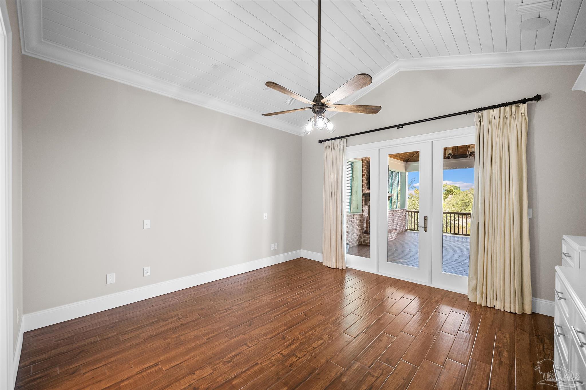 31729 River Road Orange Beach, AL 36561 - Photo 27 of 57 a view of an empty room with wooden floor and a window