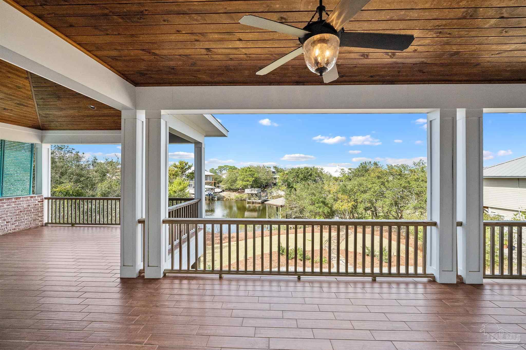 31729 River Road Orange Beach, AL 36561 - Photo 45 of 57 a view of a porch with wooden floor