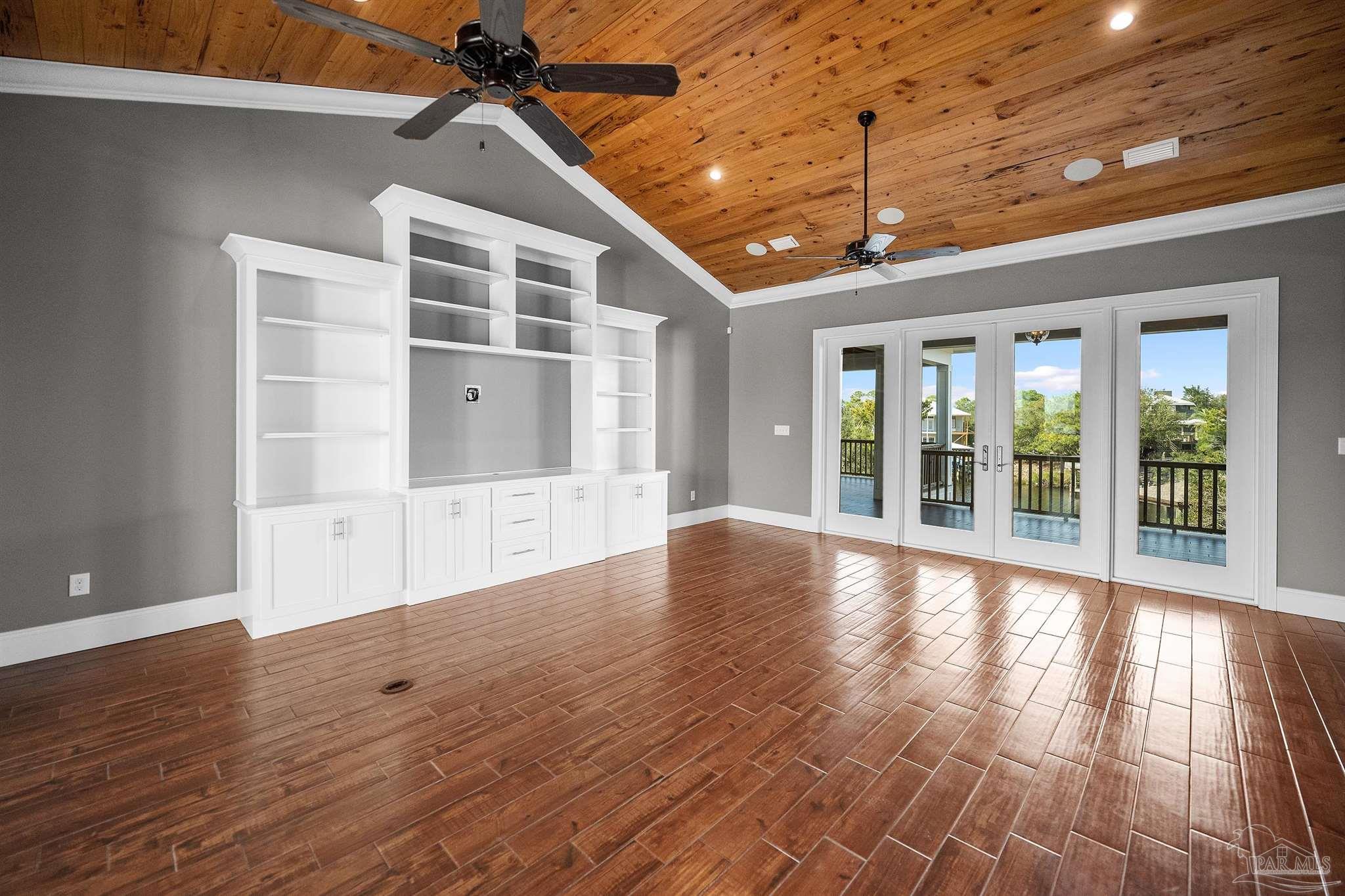 31729 River Road Orange Beach, AL 36561 - Photo 9 of 57 a view of an empty room with wooden floor and a window