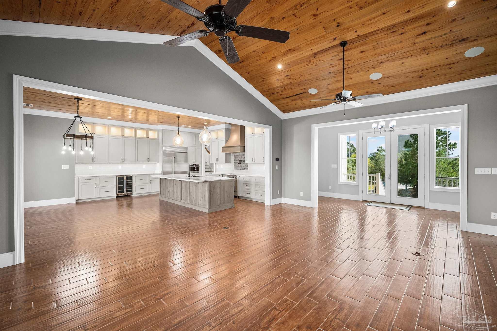 31729 River Road Orange Beach, AL 36561 - Photo 10 of 57 a view of an empty room with window and wooden floor