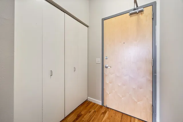 a bathroom with a glass shower door