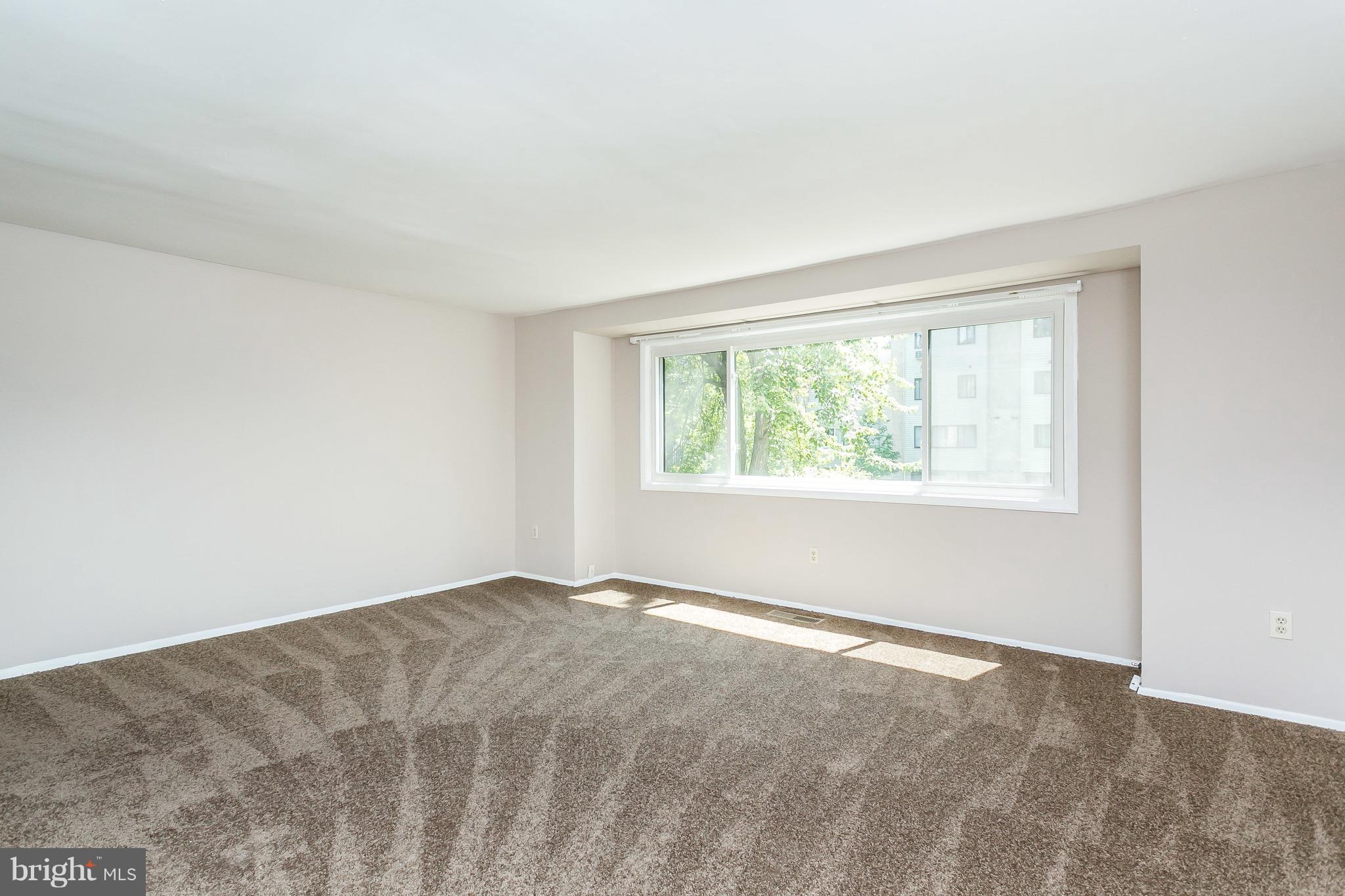 9408 Merryrest Road Columbia, MD 21045 - Photo 3 of 30 a view of an empty room with a window