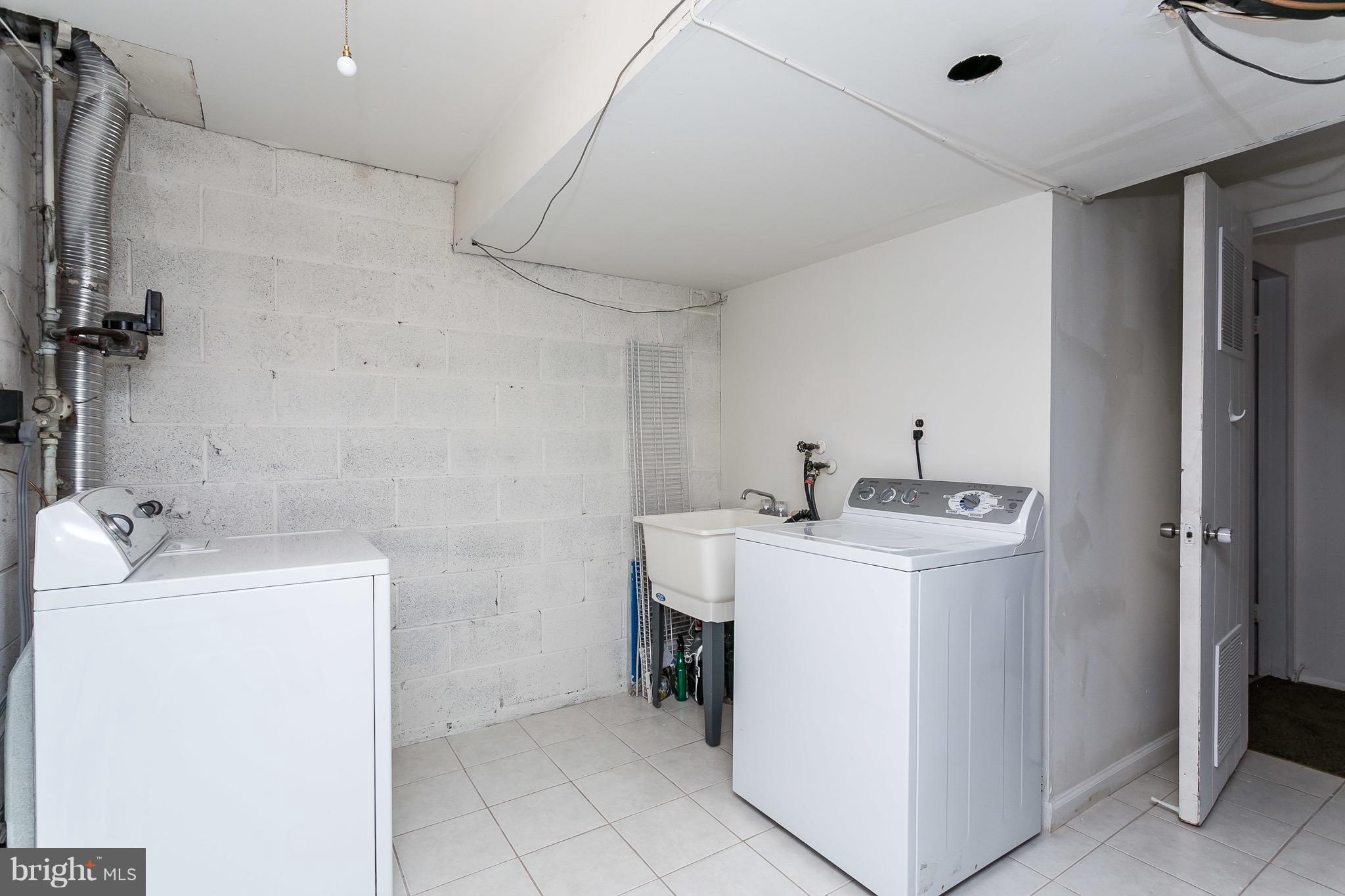 9408 Merryrest Road Columbia, MD 21045 - Photo 26 of 30 a utility room with dryer and washer