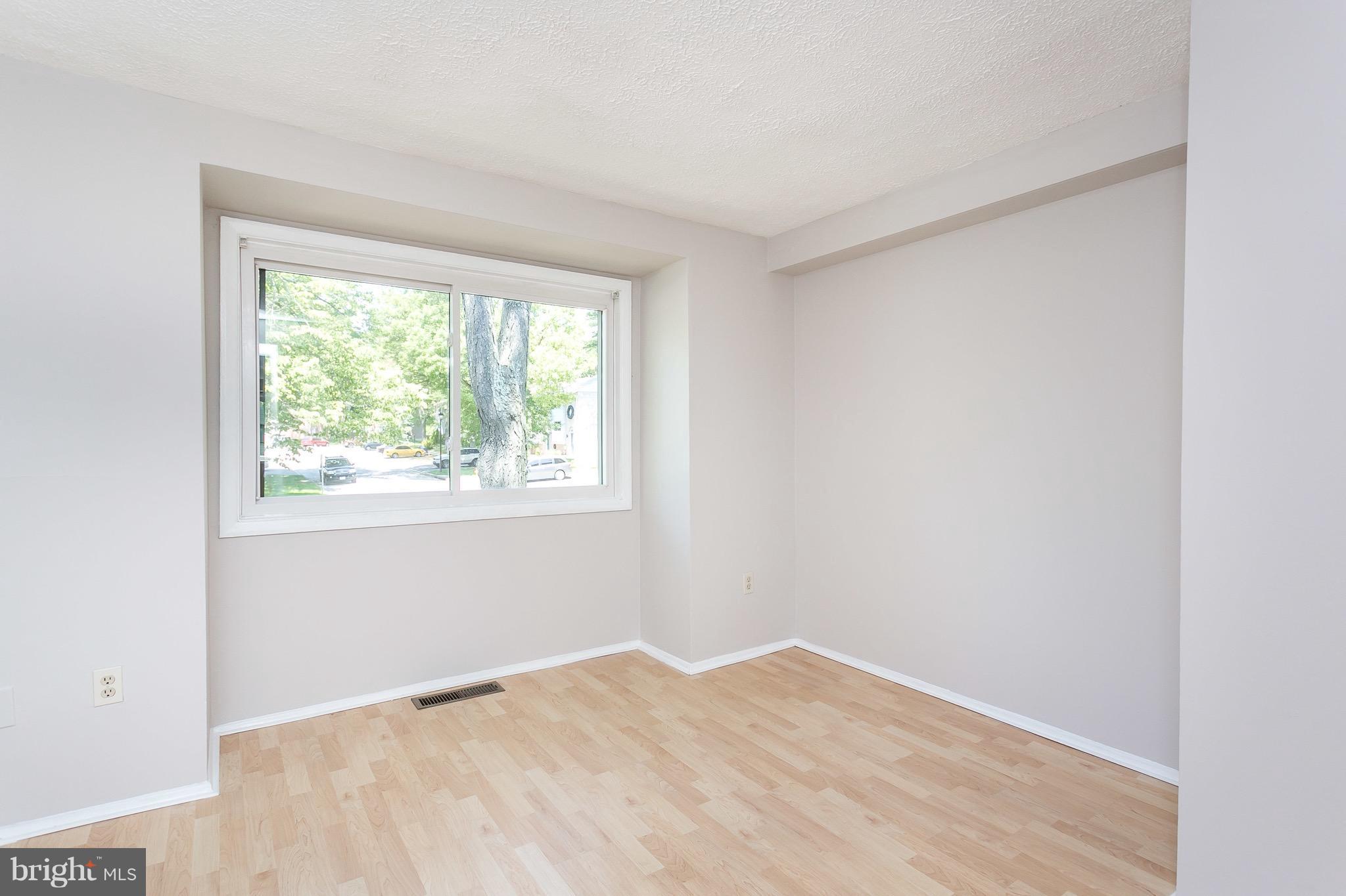 9408 Merryrest Road Columbia, MD 21045 - Photo 9 of 30 a view of empty room with wooden floor