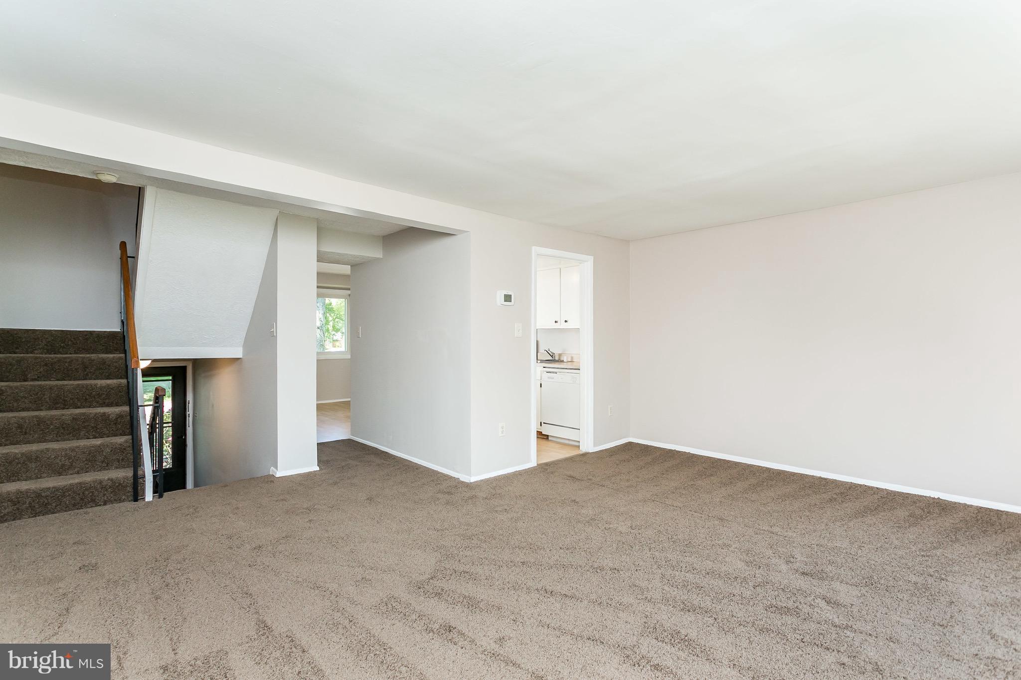 9408 Merryrest Road Columbia, MD 21045 - Photo 10 of 30 a view of an empty room and wooden floor