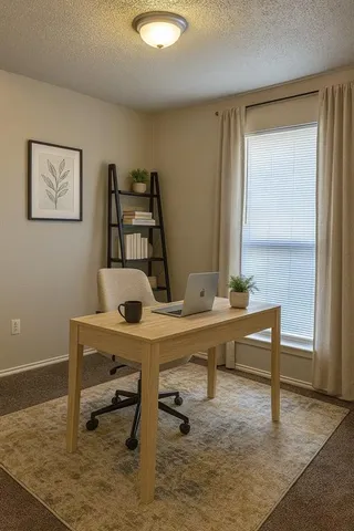 a view of a workspace with furniture
