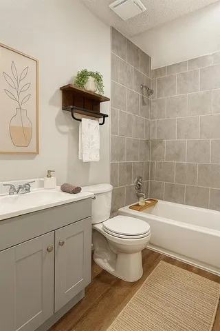 a bathroom with a sink toilet a mirror and shower