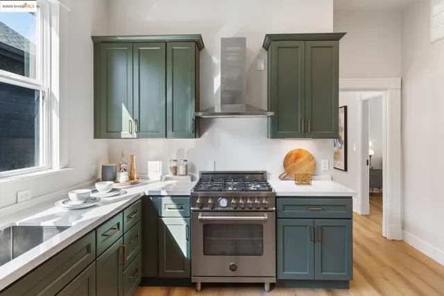 a kitchen with granite countertop a stove and a sink