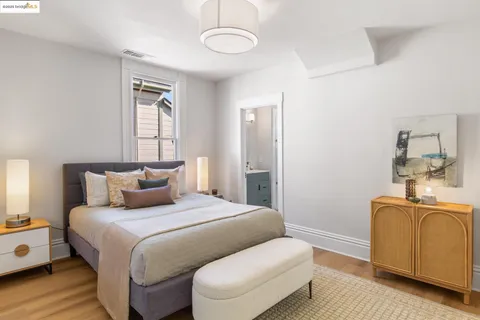 a bedroom with a bed and couch