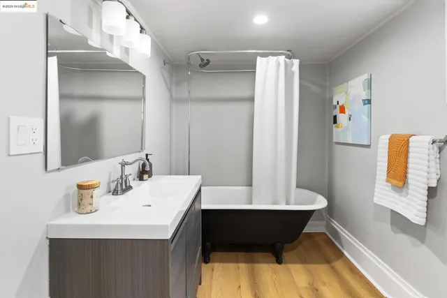 a pathway of a house with a yard and garden