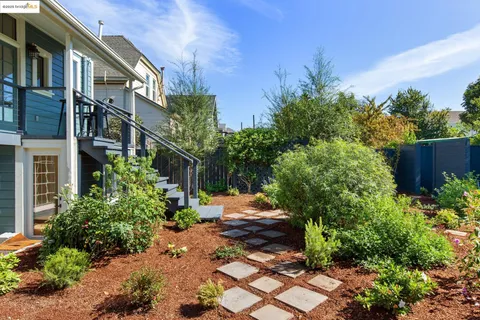 a view of a dinning table and chairs in patio of the house