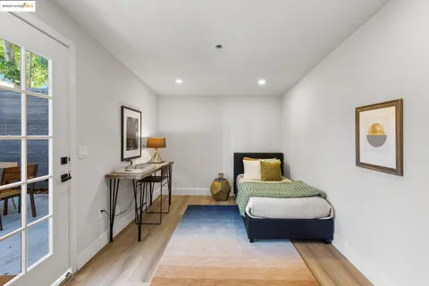 a bathroom with a sink vanity mirror and tub