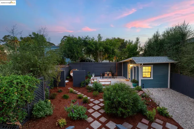 an aerial view of residential houses with city view