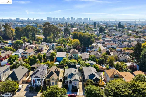 an aerial view of a house with a yard and potted plants