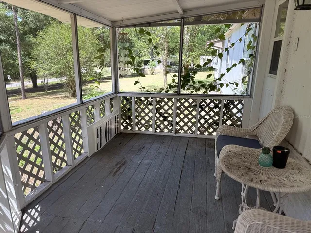 a bathroom with a toilet and a shower curtain