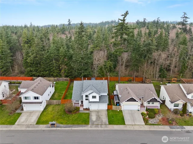 a view of house with yard and mountain view