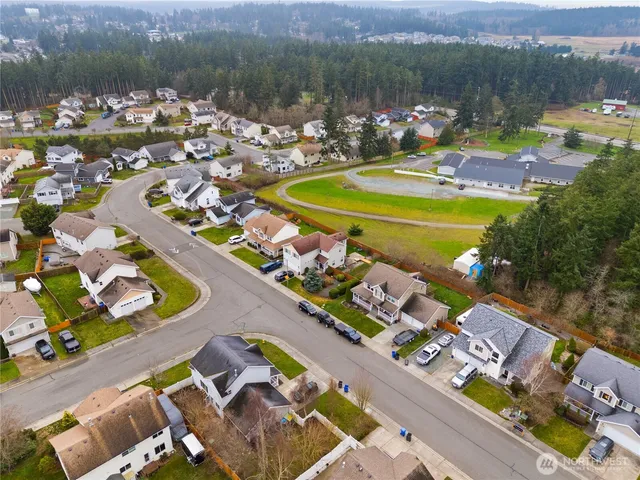 an aerial view of a house with a garden