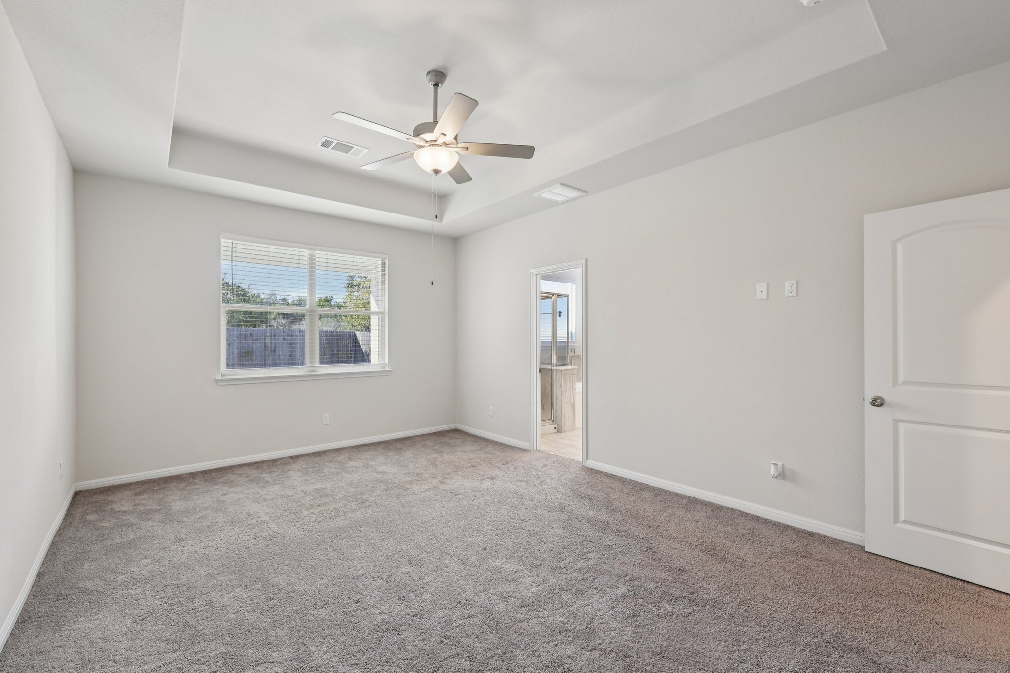 308 Castlefields Street Hutto, TX 78634 - Photo 15 of 31 an empty room with windows and fan