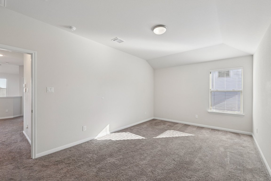 308 Castlefields Street Hutto, TX 78634 - Photo 22 of 31 an empty room with windows