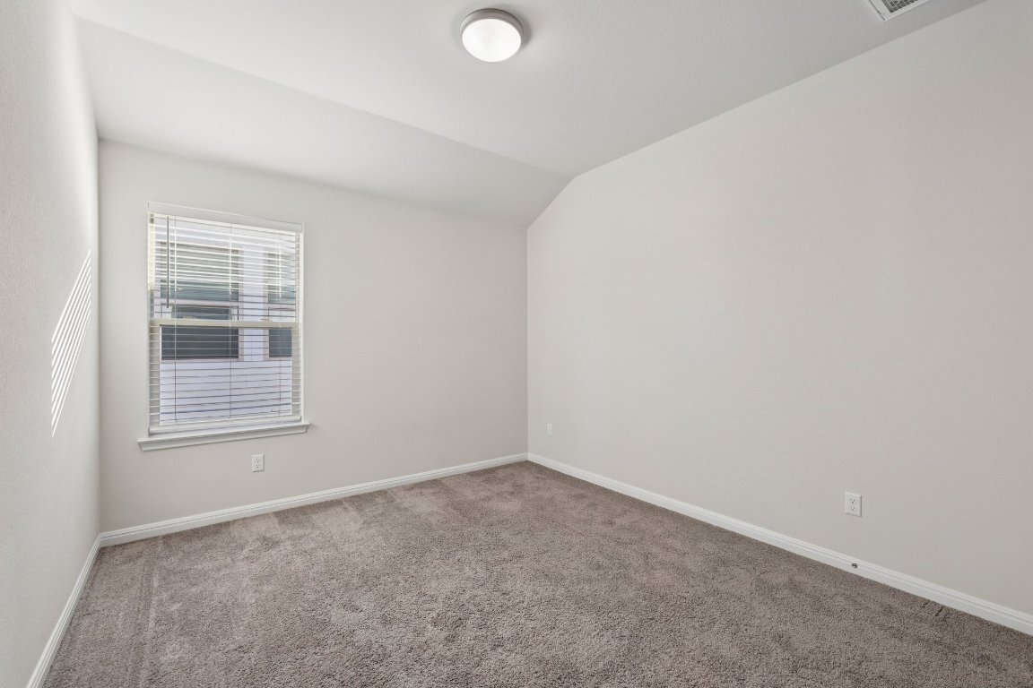 308 Castlefields Street Hutto, TX 78634 - Photo 23 of 31 an empty room with a window