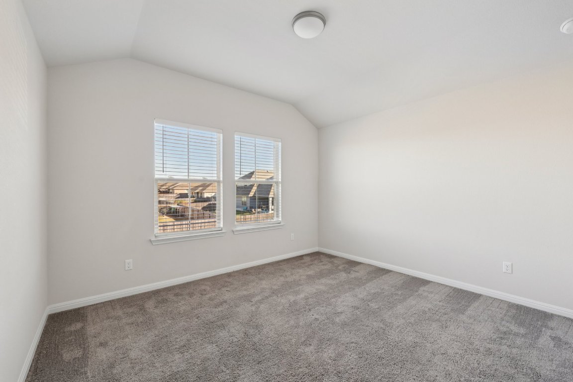 308 Castlefields Street Hutto, TX 78634 - Photo 25 of 31 an empty room with windows