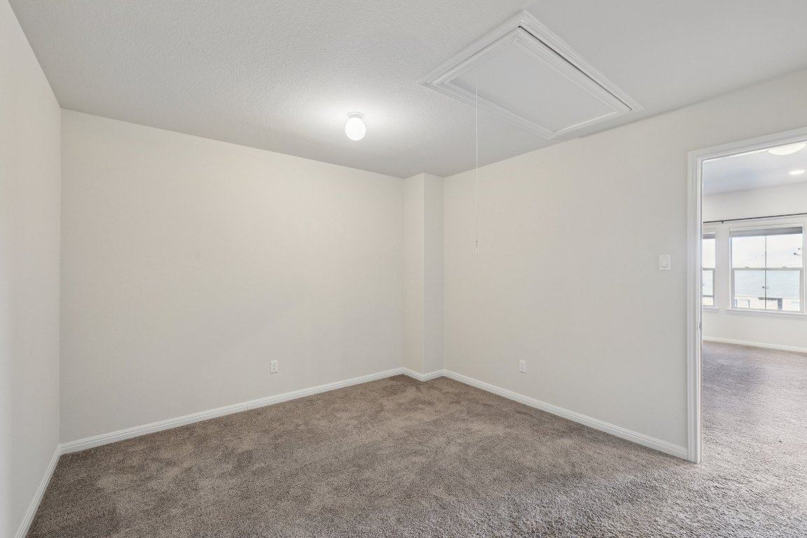 308 Castlefields Street Hutto, TX 78634 - Photo 27 of 31 an empty room with windows
