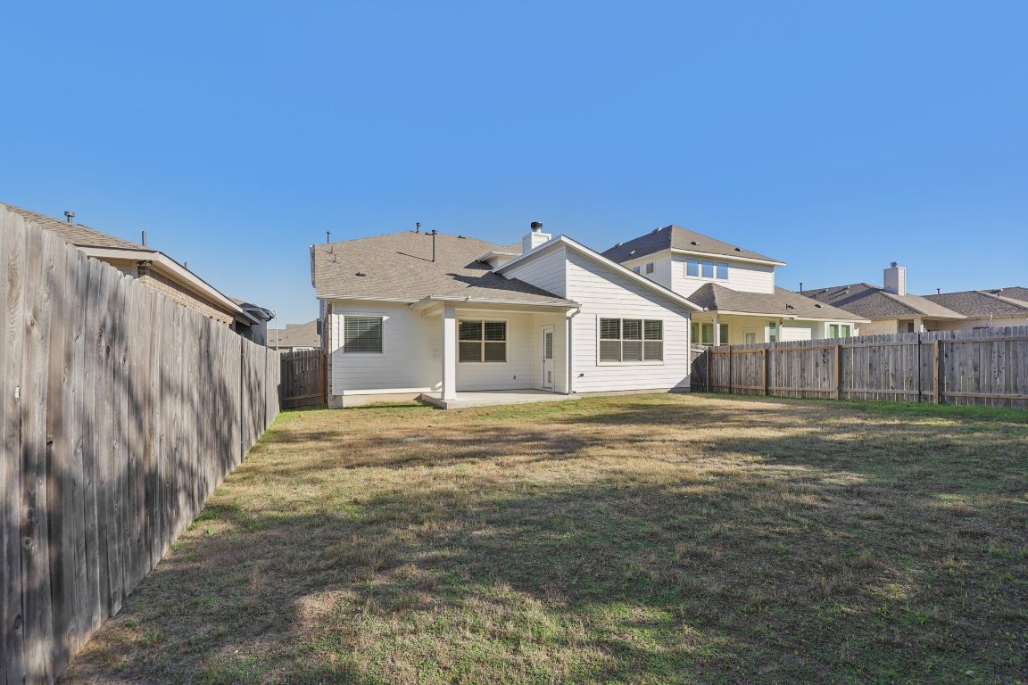 308 Castlefields Street Hutto, TX 78634 - Photo 29 of 31 a front view of a house with a yard