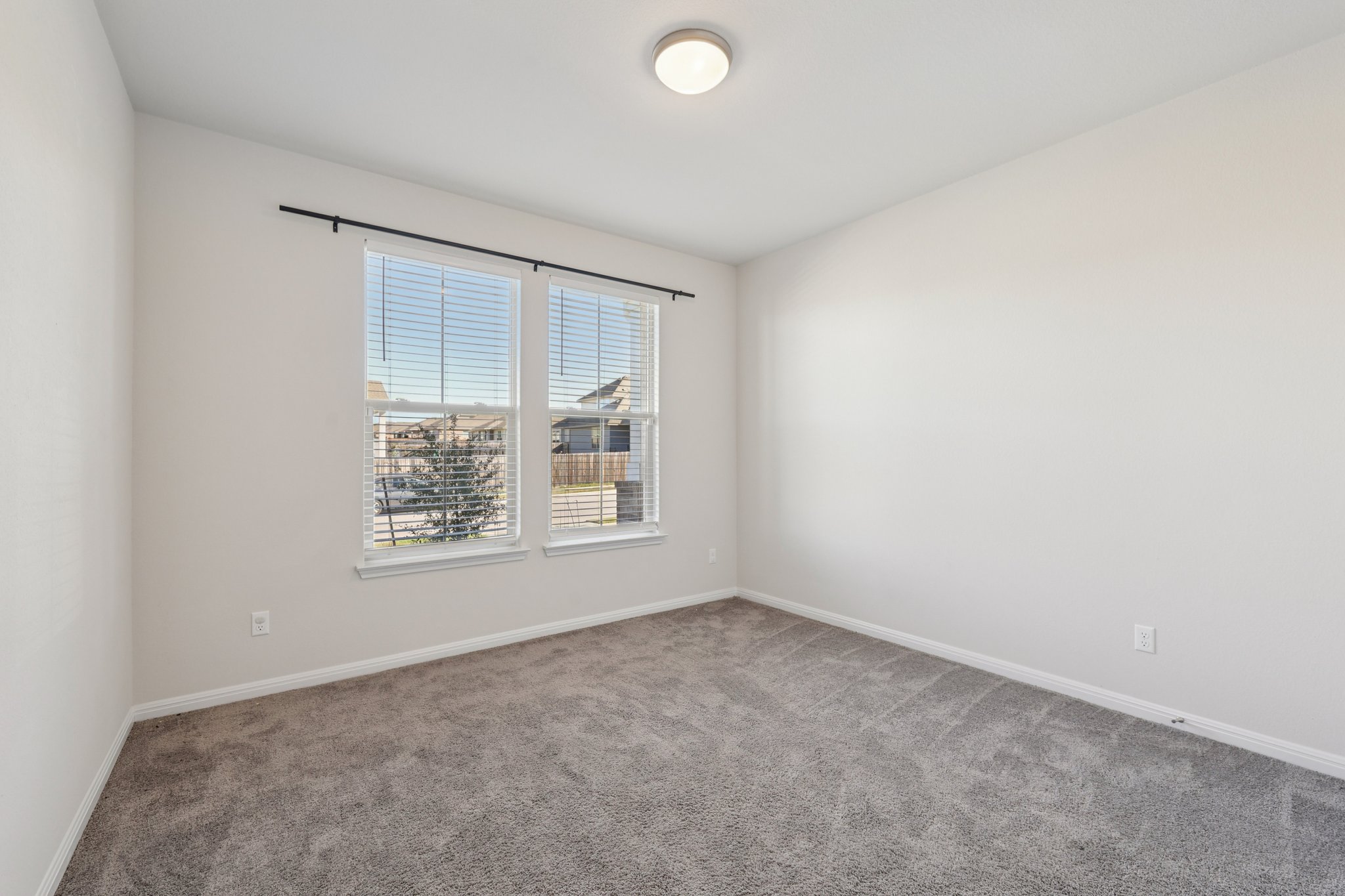 308 Castlefields Street Hutto, TX 78634 - Photo 3 of 31 an empty room with a window