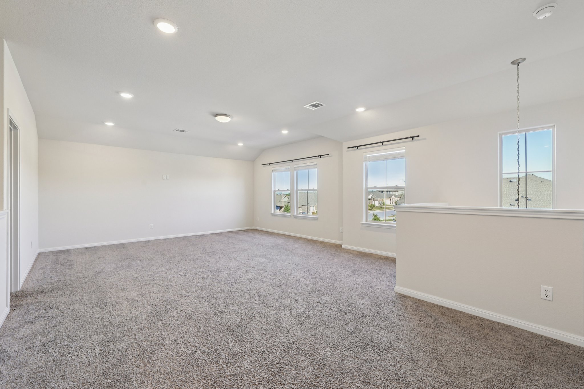 308 Castlefields Street Hutto, TX 78634 - Photo 7 of 31 a view of an empty room with kitchen and window