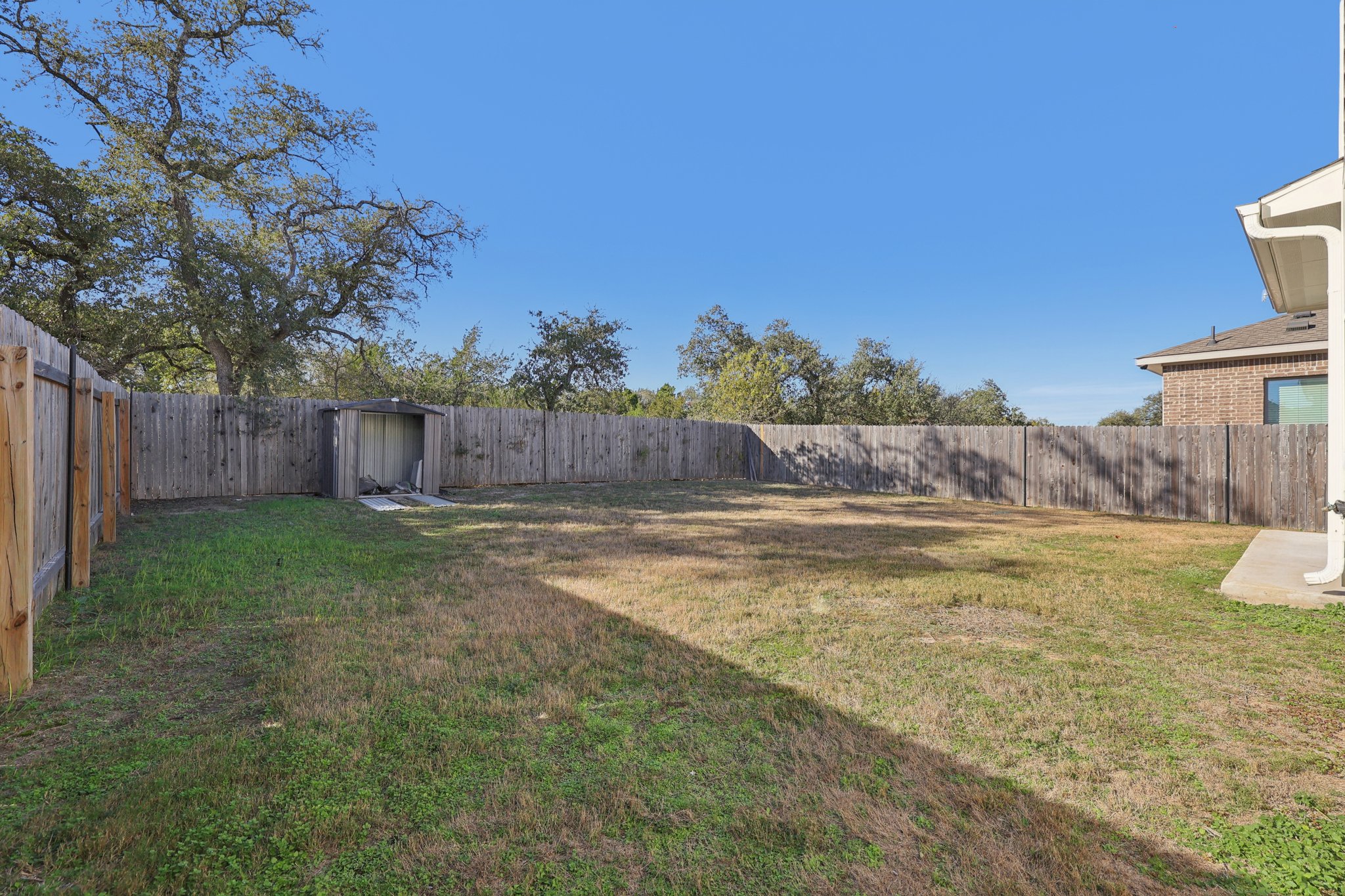 308 Castlefields Street Hutto, TX 78634 - Photo 8 of 31 a view of a backyard