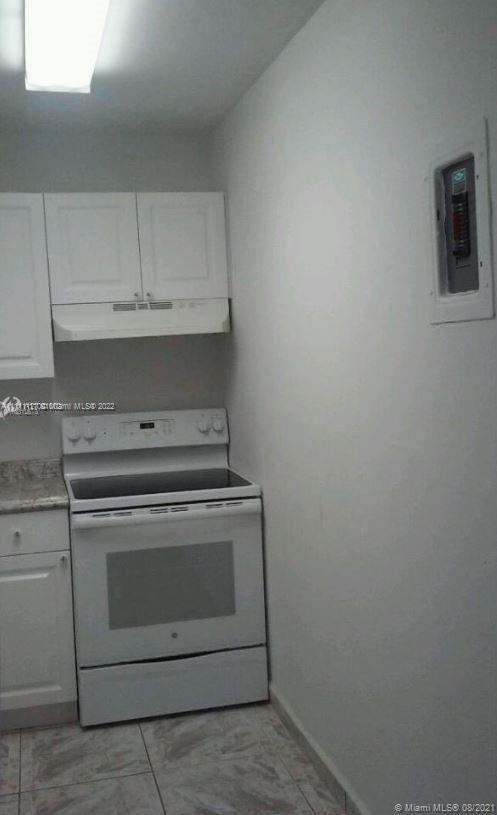 Flagami Miami, FL 33126 - Photo 3 of 6 a stove top oven sitting inside of a kitchen
