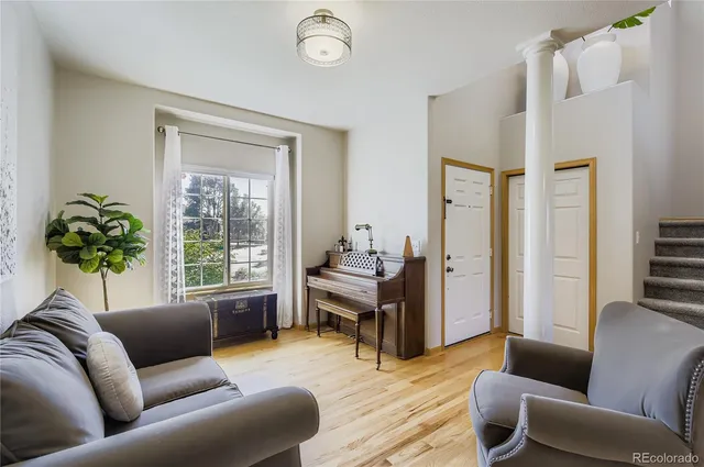 a living room with furniture and a window