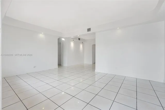 a view of an empty room and window