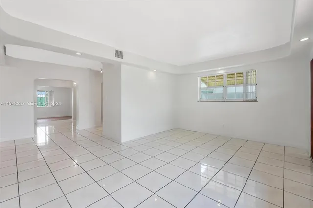 a view of an empty room and window