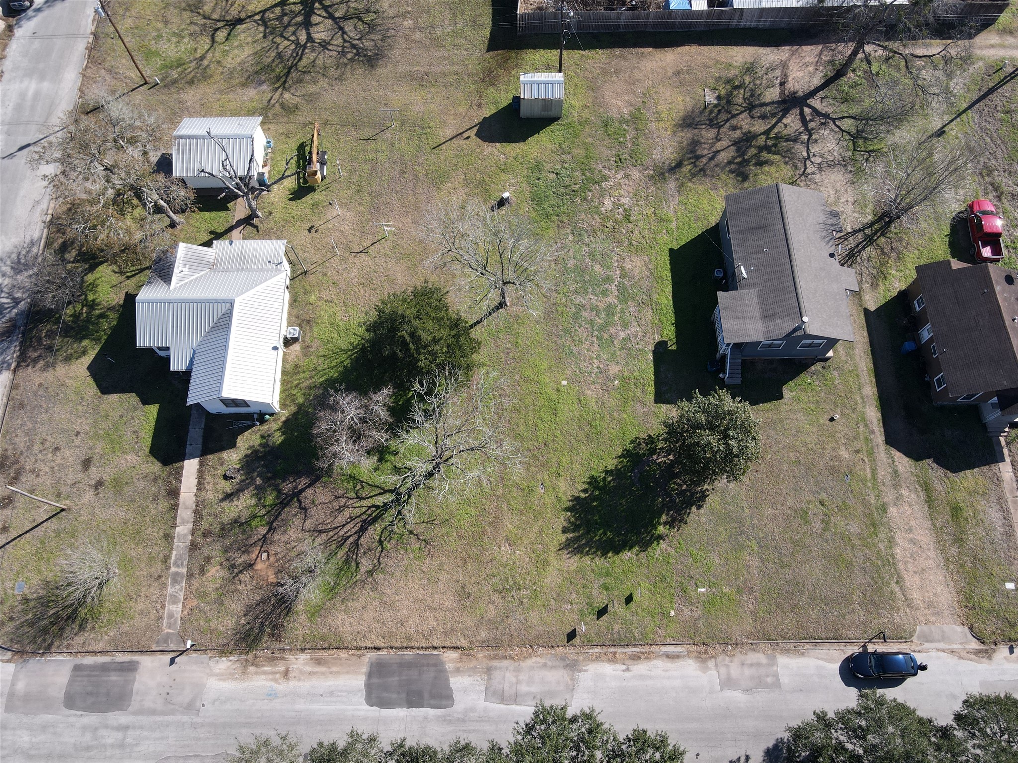1026 15th Street Hempstead, TX 77445 - Photo 3 of 6 an aerial view of a house with a yard
