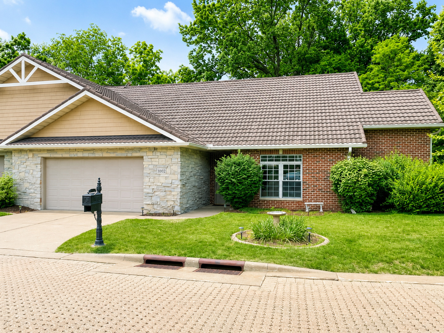 1002 2nd St Court Moline, IL 61265 - Photo 1 of 31 a front view of a house with a yard and potted plants
