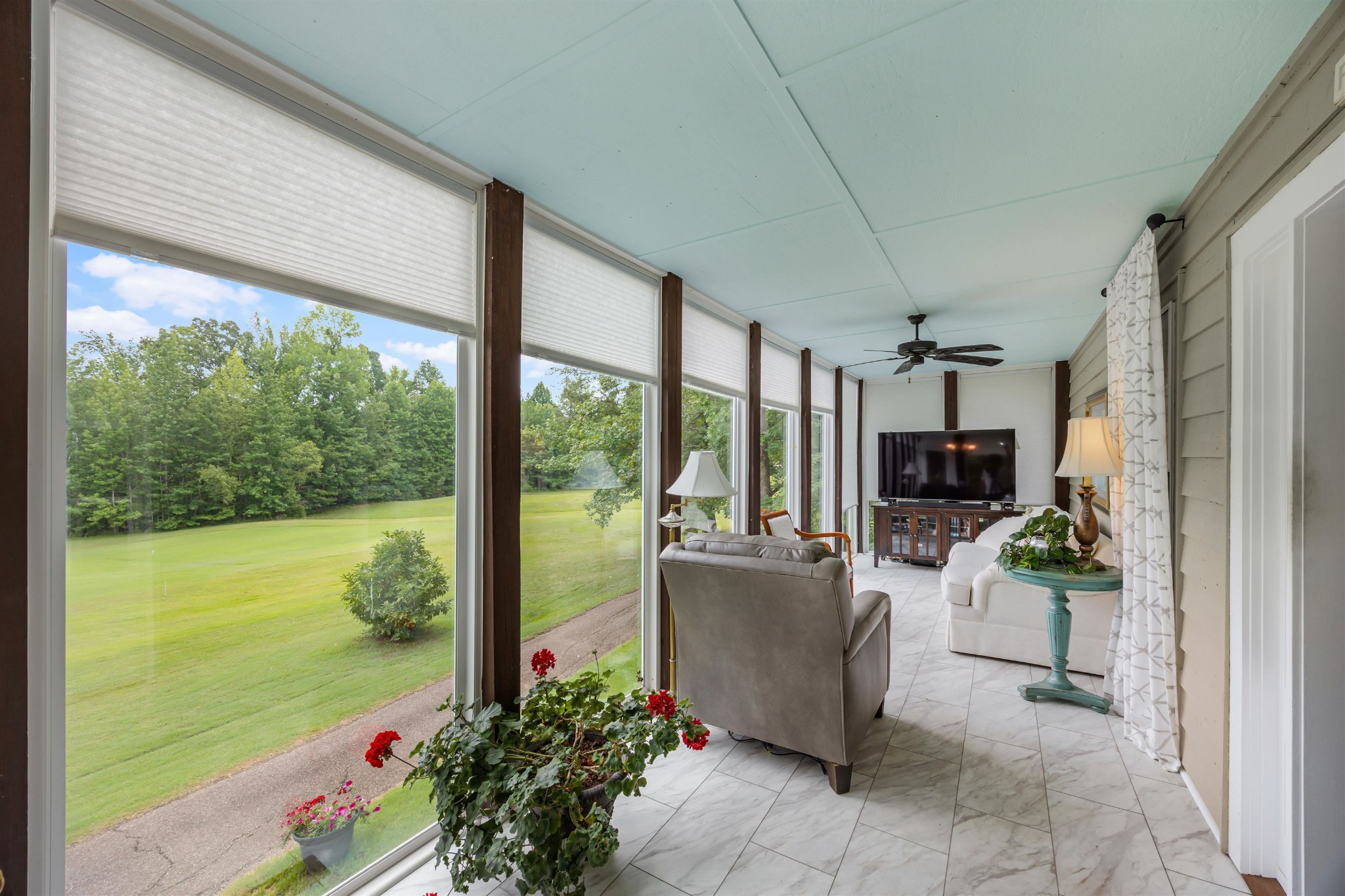 40 Vantage Pointe Counce, TN 38326 - Photo 18 of 25 a living room with couches potted plants and a floor to ceiling window