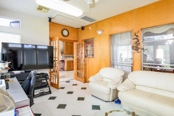 a living room with furniture and a large window