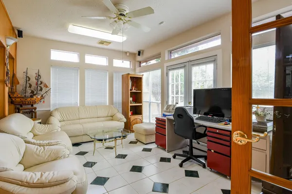a living room with furniture and a flat screen tv