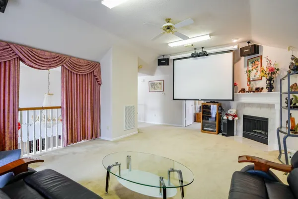 a bedroom with furniture and a fireplace