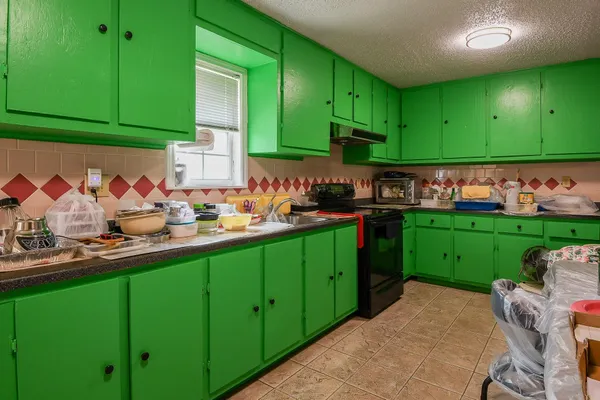 a kitchen with lots of counter space and cabinets
