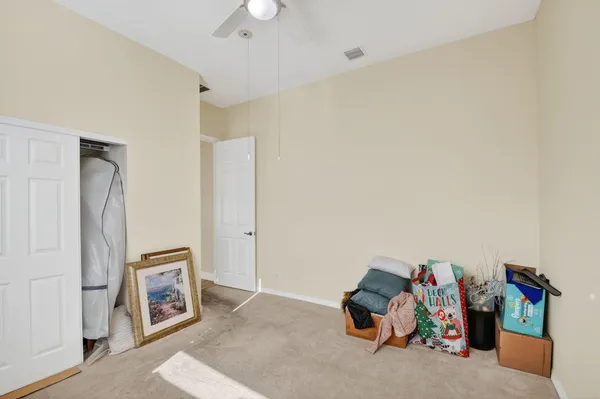 an aerial view of residential houses with outdoor space and trees