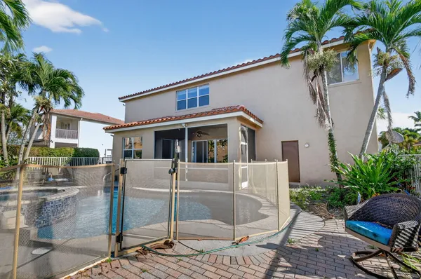a view of a swimming pool with a patio