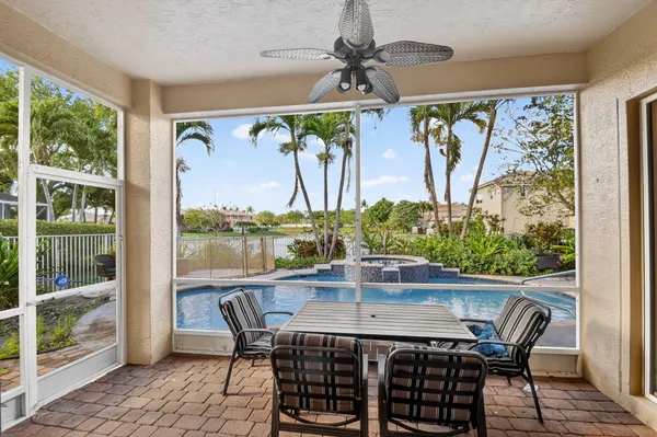 a kitchen with stainless steel appliances kitchen island granite countertop a refrigerator and a stove top oven