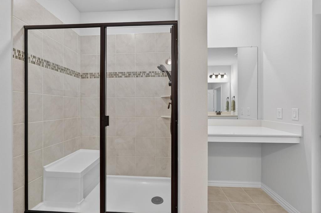651 Watters Road, Unit 5305 Allen, TX 75013 - Photo 18 of 40 a bathroom with a sink and mirror
