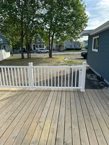 a view of a swimming pool and a yard