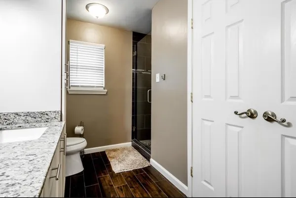 a bathroom with a sink and toilet