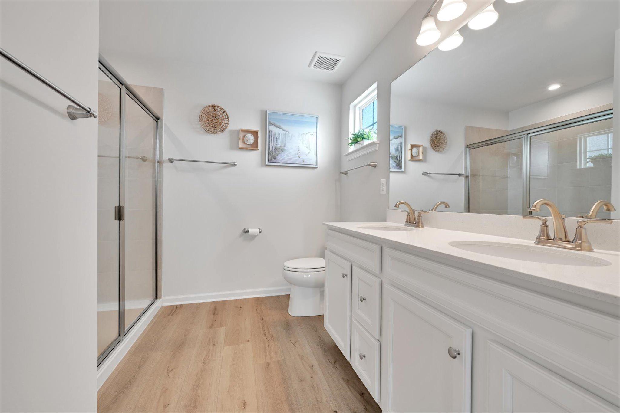 415 Courtland Road Atglen, PA 19310 - Photo 12 of 26 a spacious bathroom with a double vanity sink toilet and shower