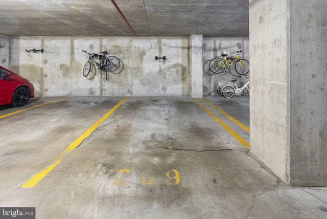 a living room with couches and painted walls with painted walls